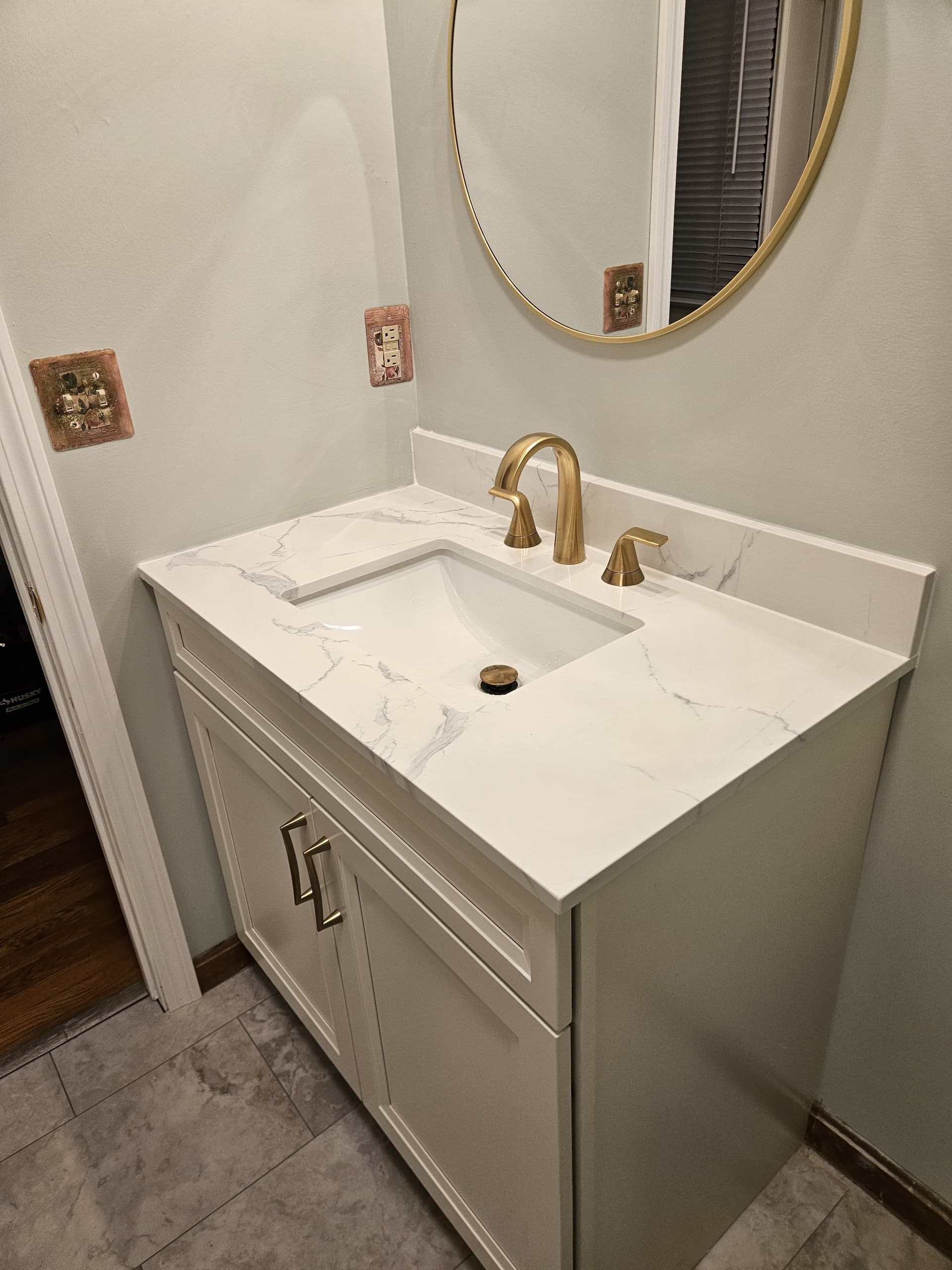 Sleek Bathroom Vanity Upgrade with Gold Accents image